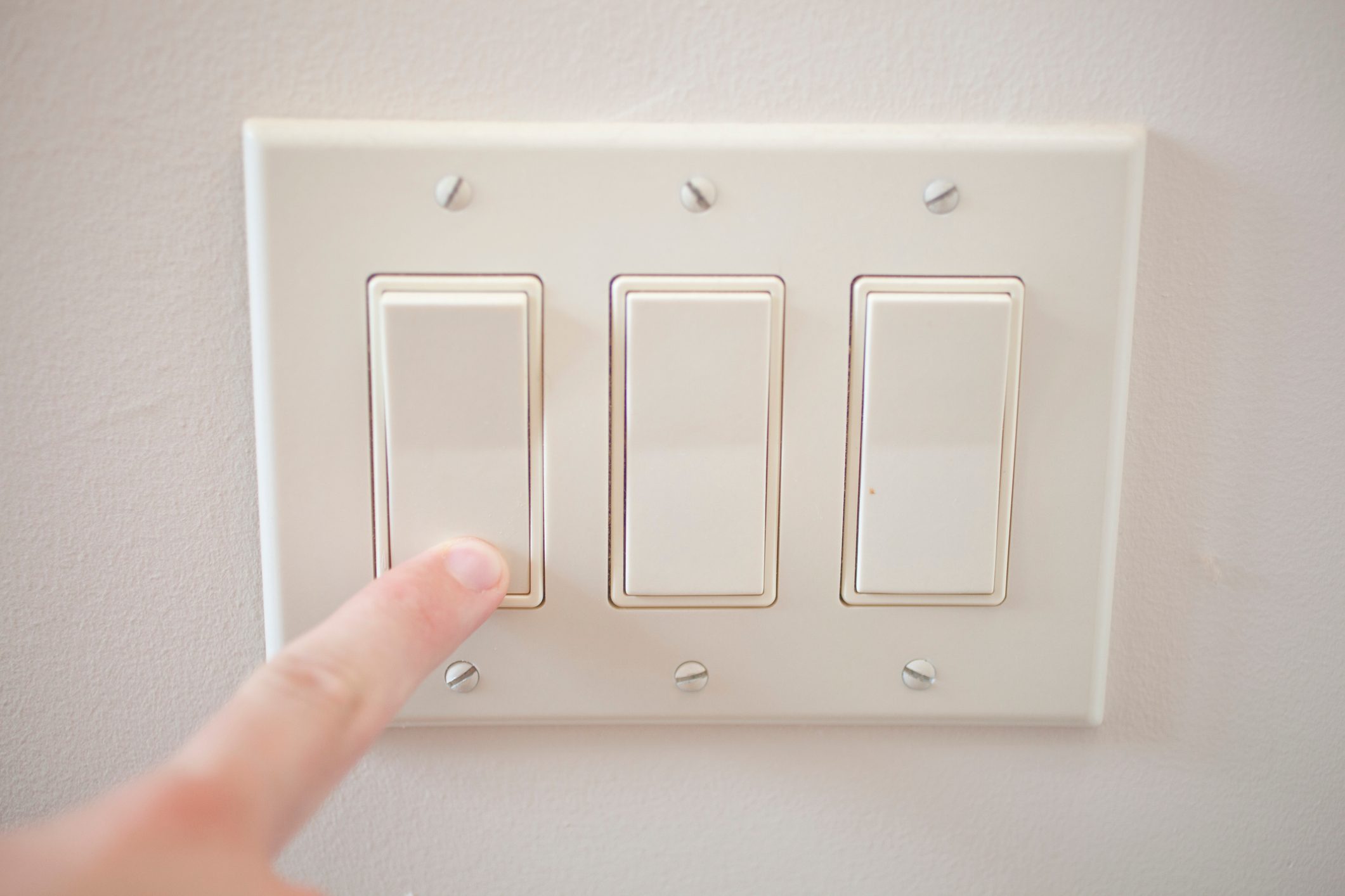 finger switching off the light