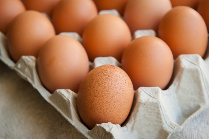 Brown eggs in a cardboard carton