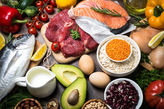 Balanced diet food background. Organic food for healthy nutrition. Ingredients for cooking. Top view stone table.