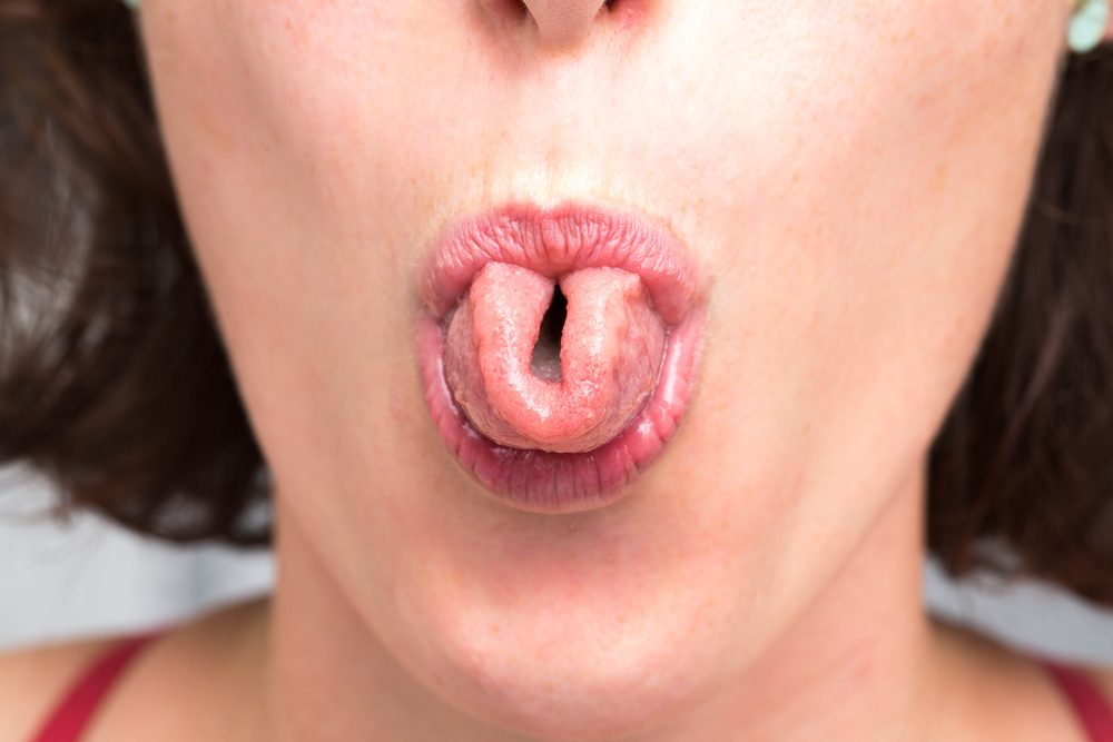 Woman rolling her tongue