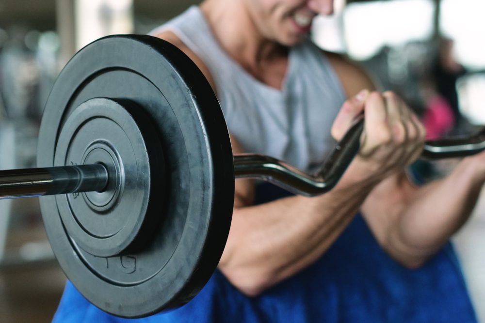 man lifting weights