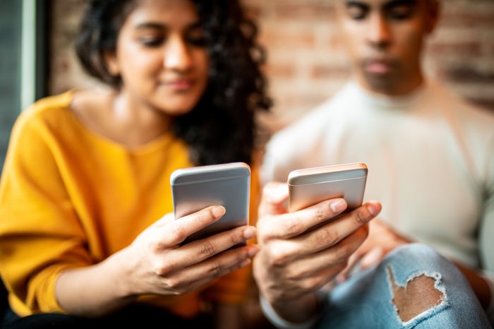 friends looking at social media on phones