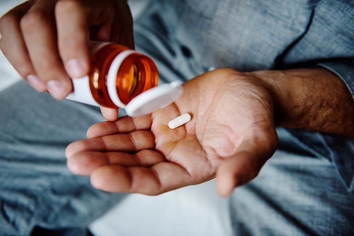 capsule in man's hand