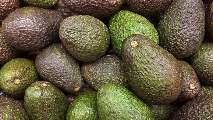 pile of green avocados