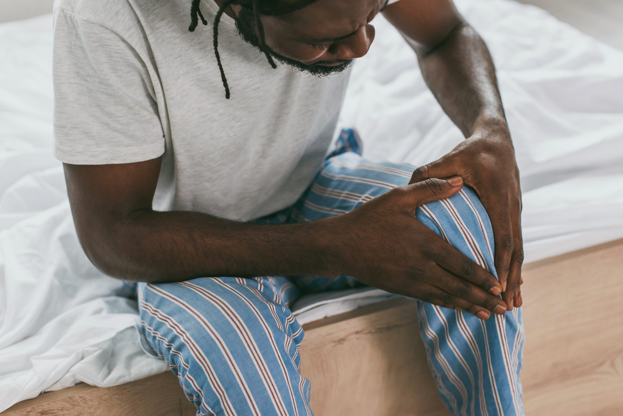 man experiencing aches and pains