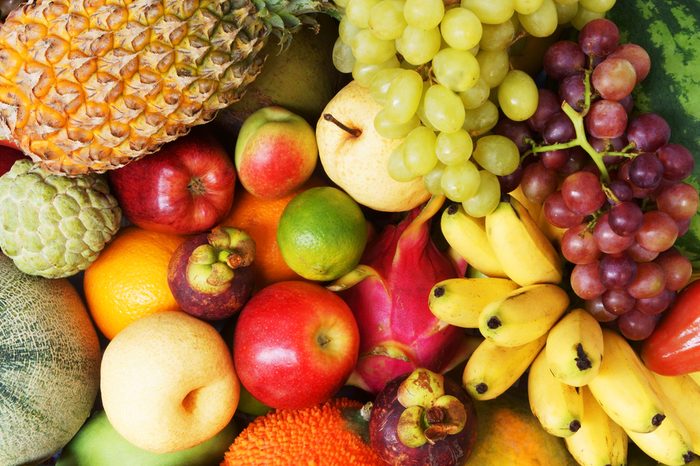 Fruit background, many fresh fruits mixed together