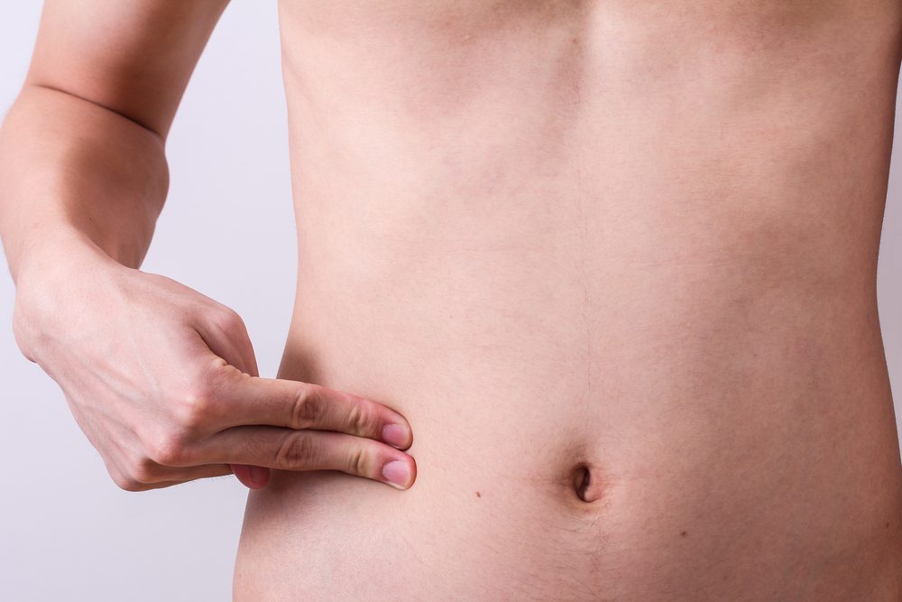 man finger push at belly or appendix