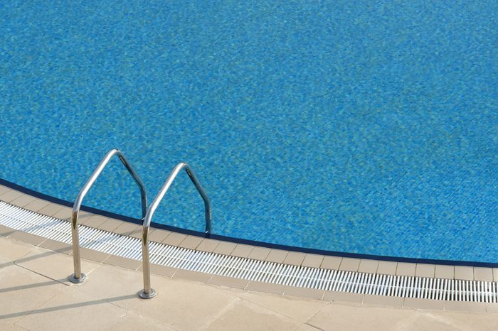 bright blue swimming pool with steps