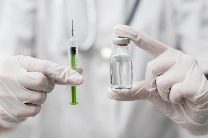 Syringe, medical injection in hand. Vaccination equipment with needle.