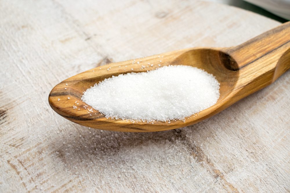Artificial Sweeteners and Sugar Substitutes in wooden spoon. Natural and synthetic sugarfree food additive: sorbitol, fructose, honey, Sucralose, Aspartame