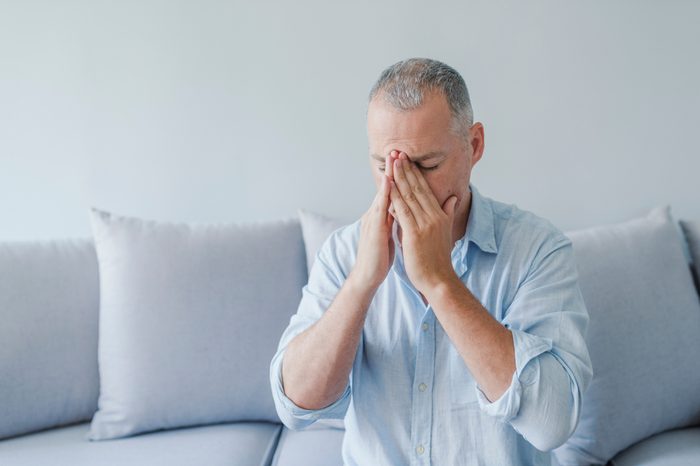Man with severe headache migraine.