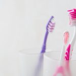 Toothbrush in the bathroom in a glass
