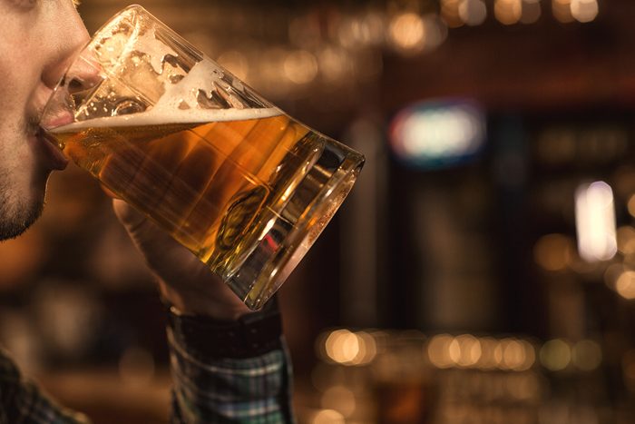Cropped close up of a man drinking beer at the bar copyspace beverage brewery brewing delicious thirst thirsty sipping relaxing alcohol drink party event celebrate cool tasty leisure weekend concept