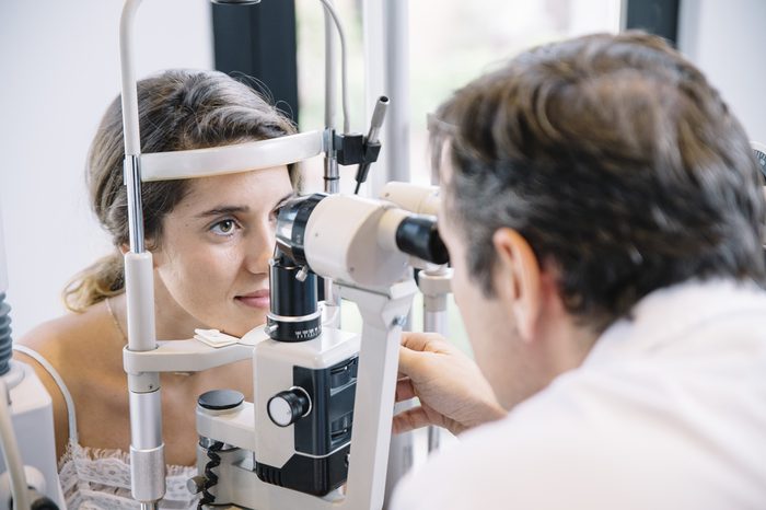 Eye Doctor examining a young patient