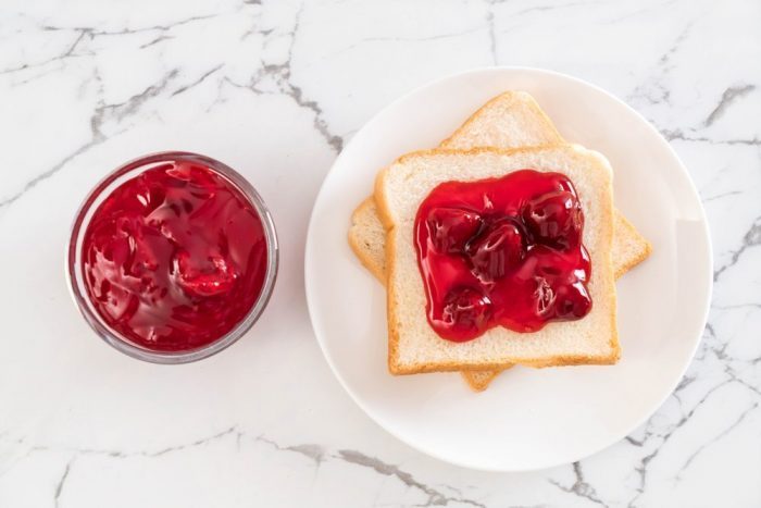 bread with strawberry jam for breakfast