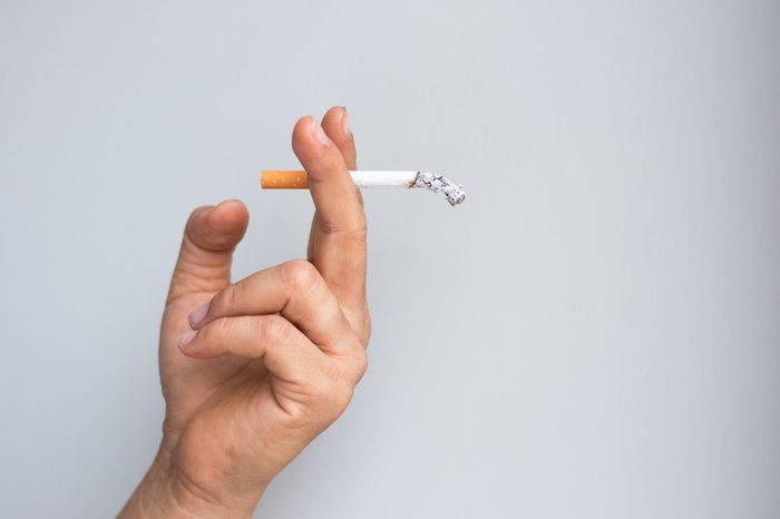 man smoking a cigarette