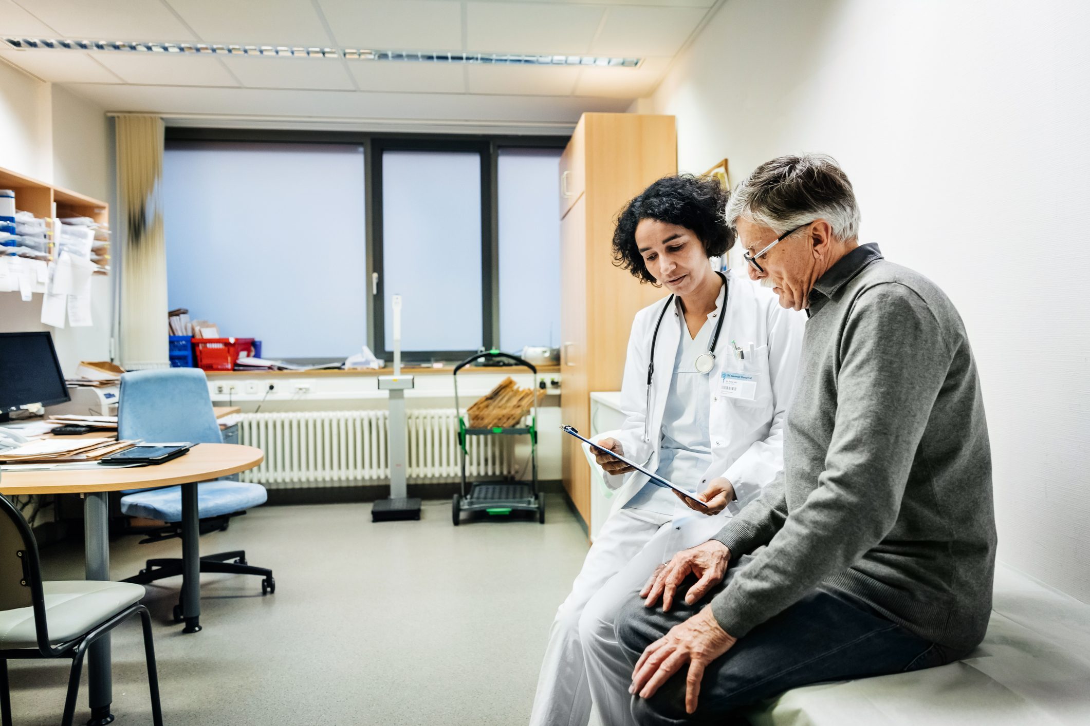 elderly man talking to his doctor about test results