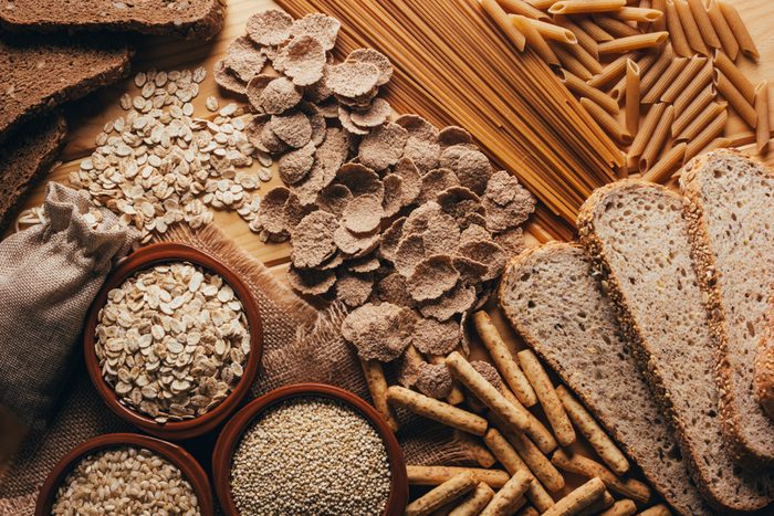 Wooden table full of fiber-rich whole foods, perfect for a balanced diet