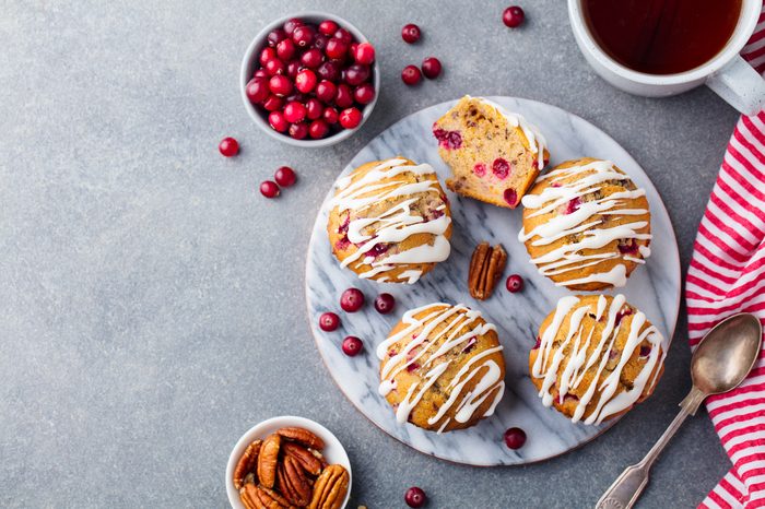 Muffins, cakes with cranberry and pecan nuts. Christmas decoration.
