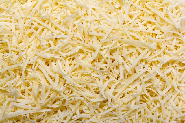 Grated pizza cheese (mozzarella ) close up texture