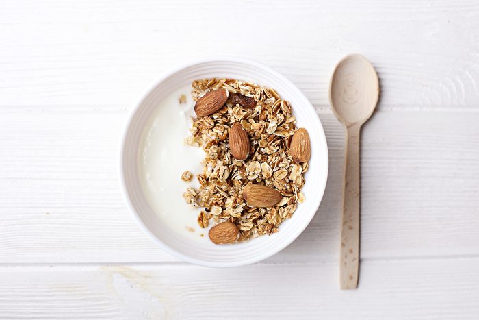bowl of granola with yogurt and milk