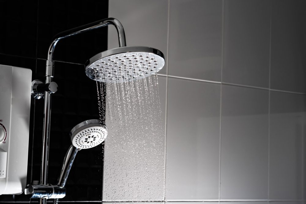Close up of Water flowing from shower in the bathroom