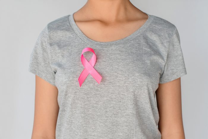 womaen holding pink ribbon breast cancer awareness. concept healthcare and medicine