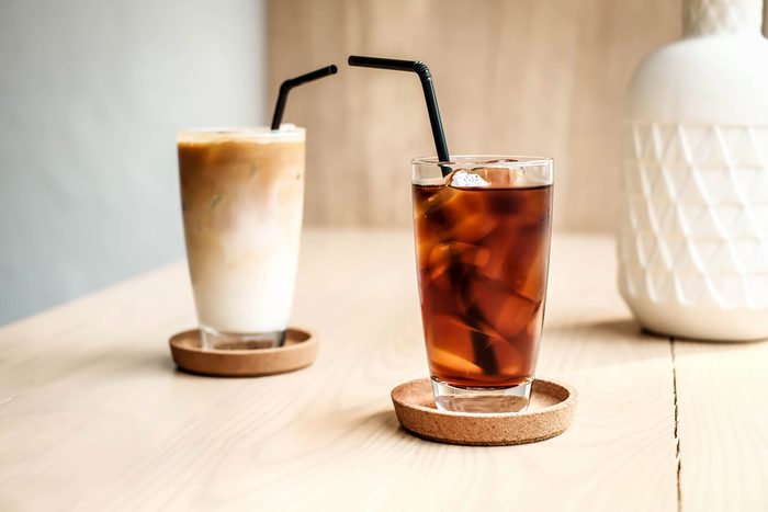 Glass of cold brew coffee and latte at cafe