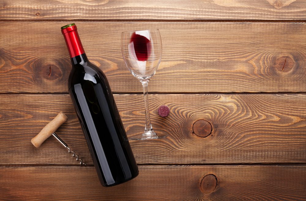 wine bottle, glass and corkscrew