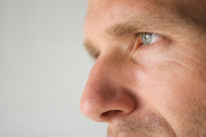 sinus infection close up of man's nose