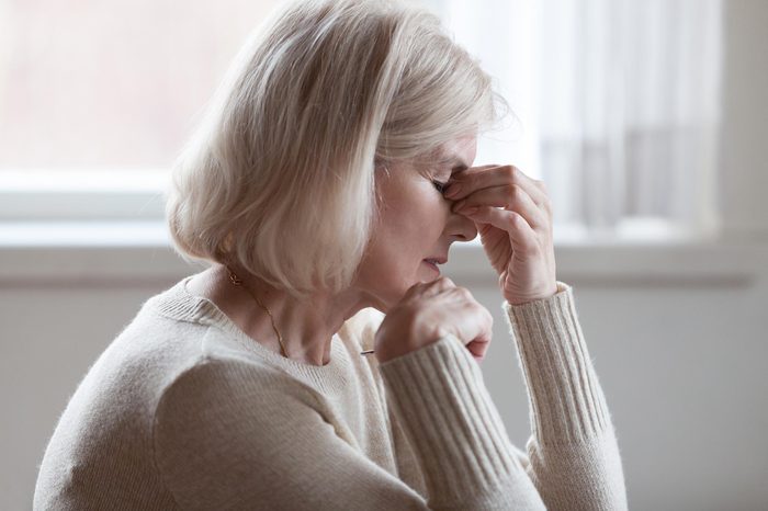 woman headache senior