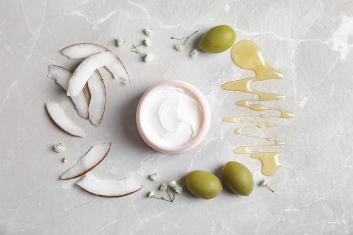 Beautiful composition with jar of cream on light background, flat lay