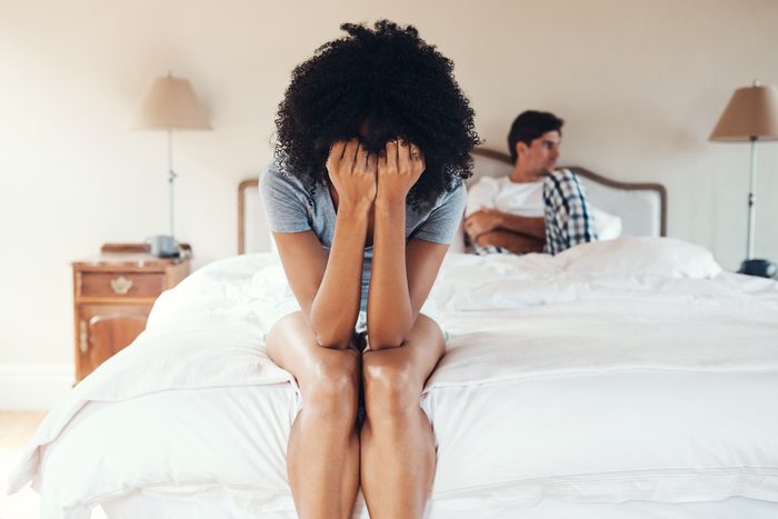 couple arguing in bed