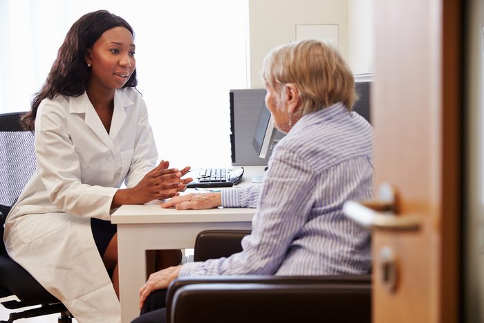 doctor consulting with senior patient