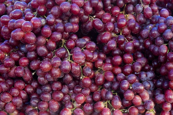 Red wine grapes background