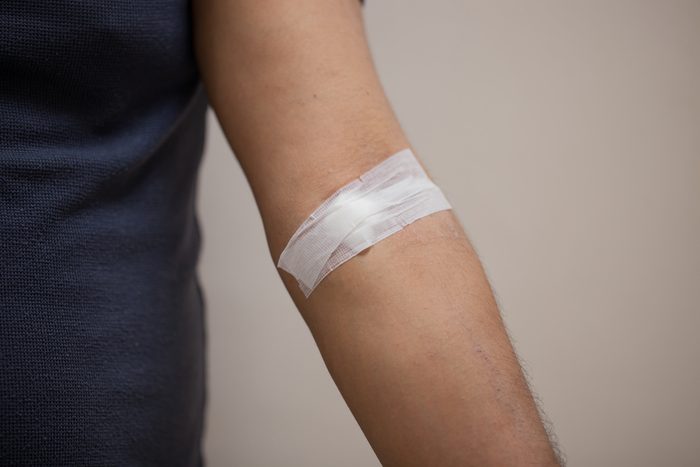 cotton closed on men arm after blood samples for examination
