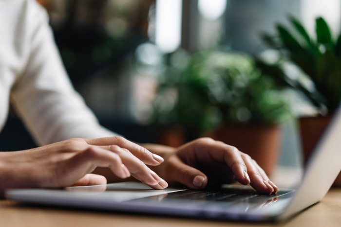 hands using a laptop