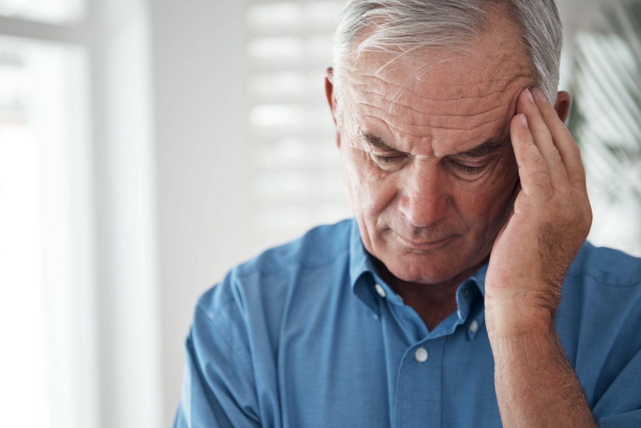 senior man with headache