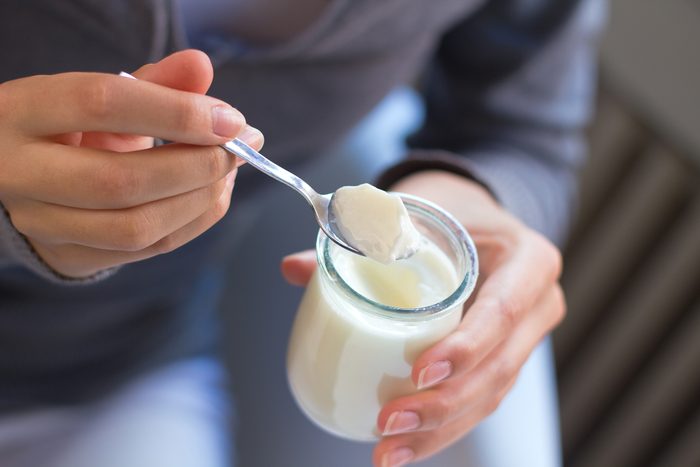 close up of person eating yogurt