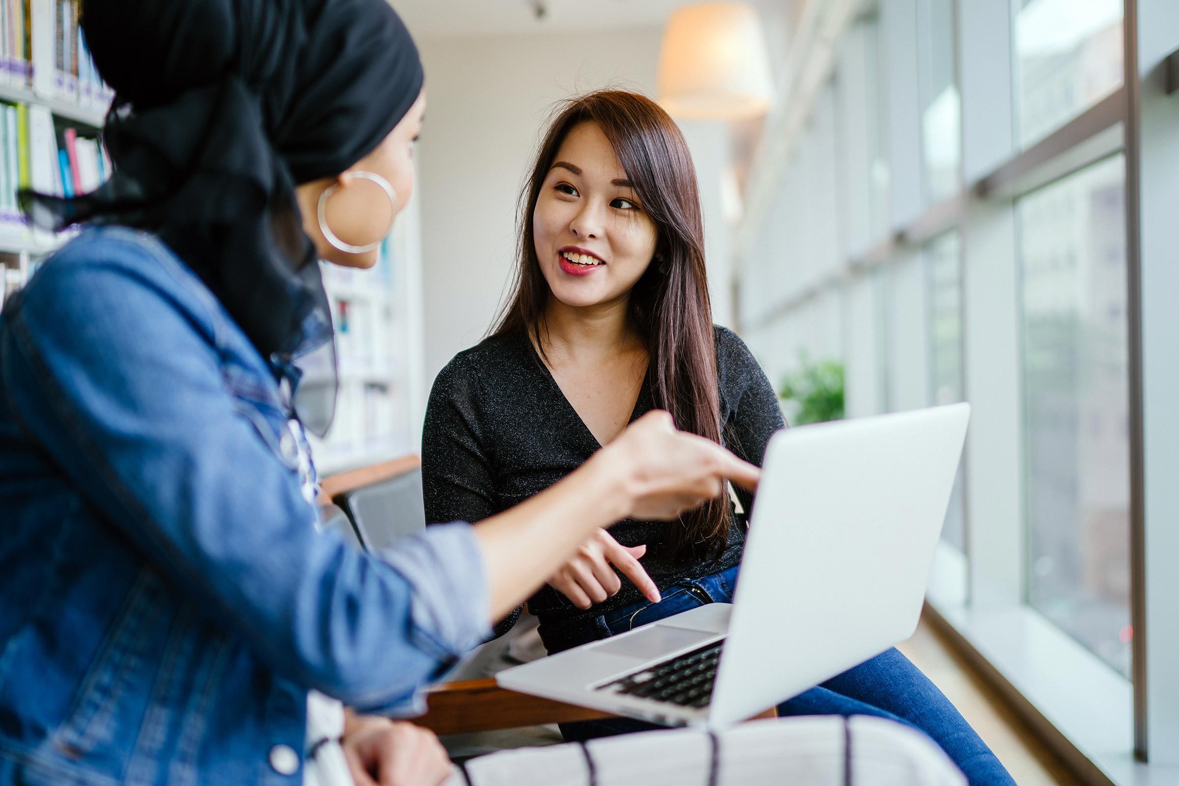 women talking office