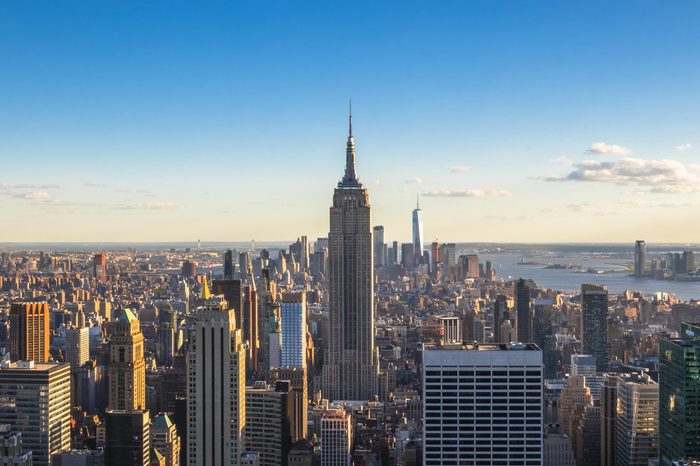 New York City, United States - May 15, 2017: Empire State Building and skyscrapers at sunset.