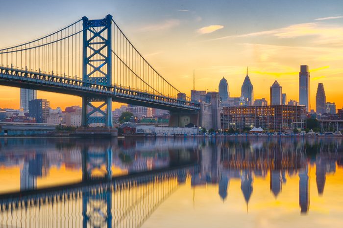 Philadelphia sunset skyline and Ben Franklin Bridge refection from across the Delaware River