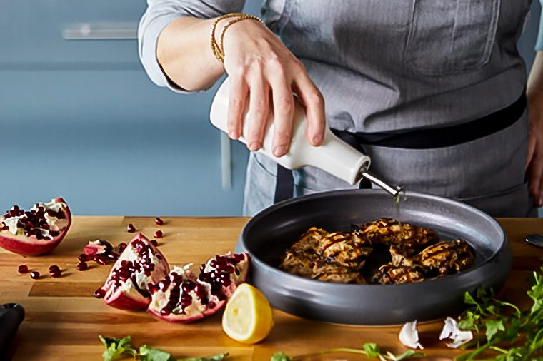 pouring oil into pan, cooking