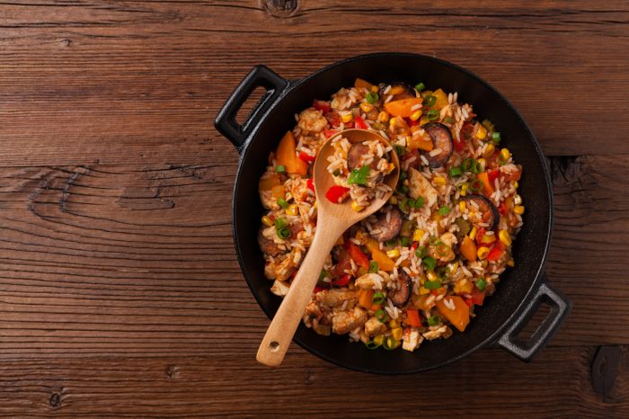 Traditional jambalaya perepared in wok, serwed on plate. Top view.