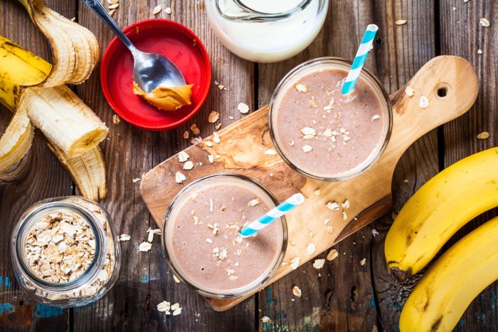 Healthy breakfast: banana smoothie with oatmeal, peanut butter and milk