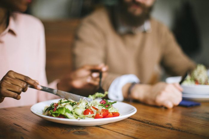 couple eating salad for dinner