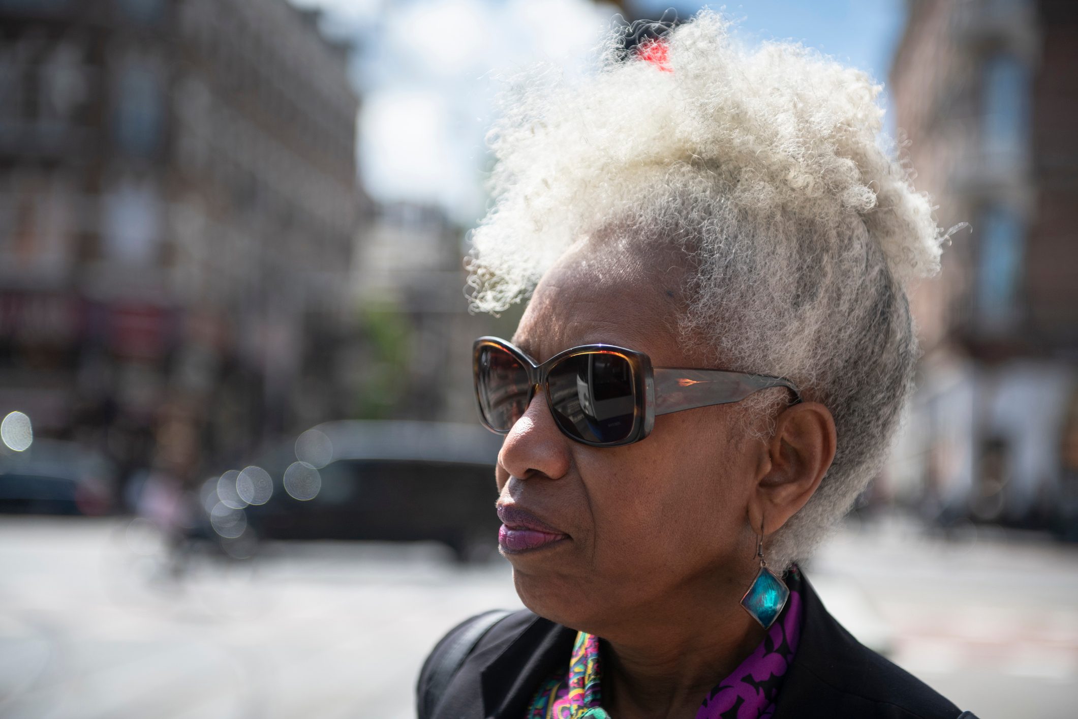 close up of woman wearing sunglasses outside