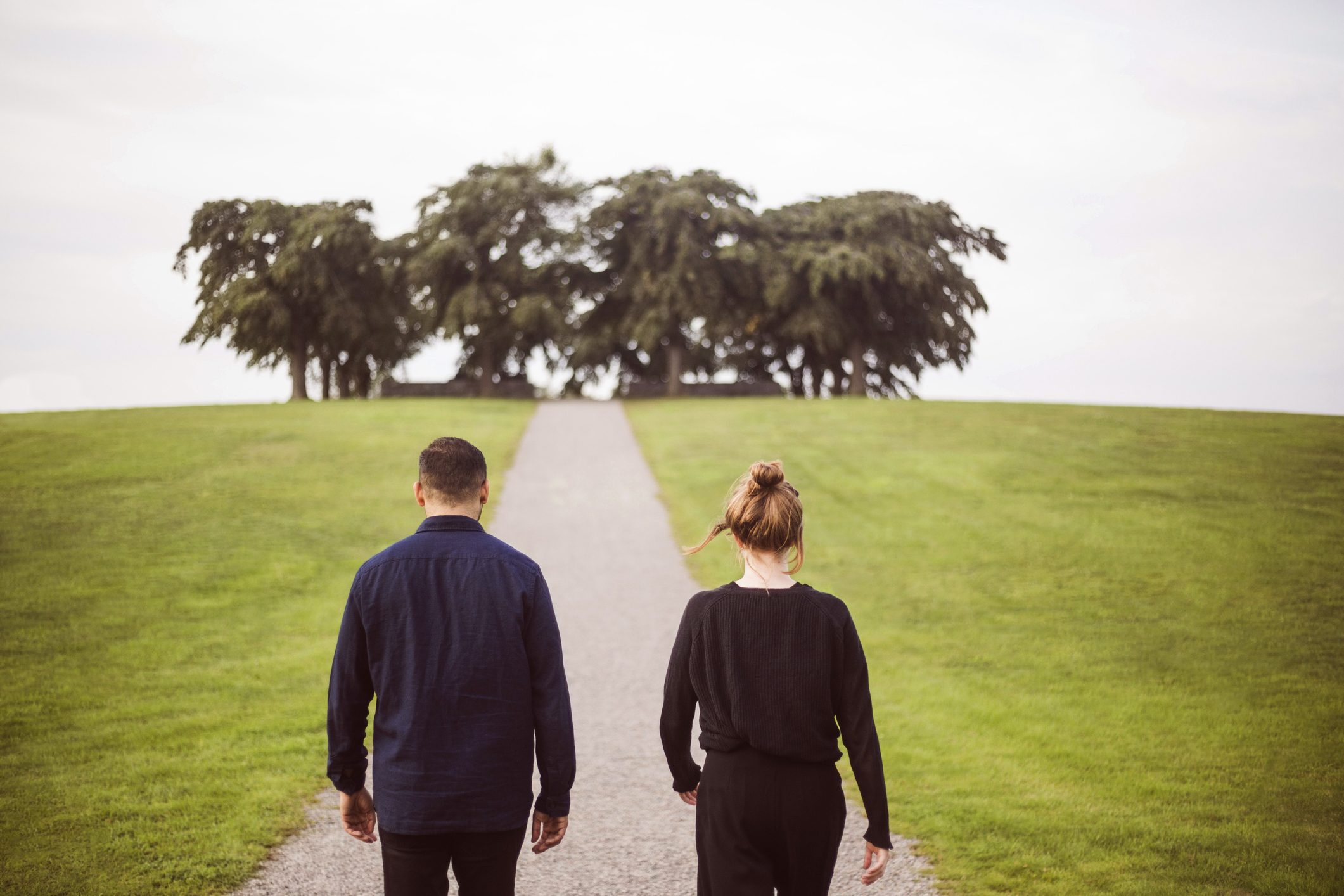 rear view of couple walking outside