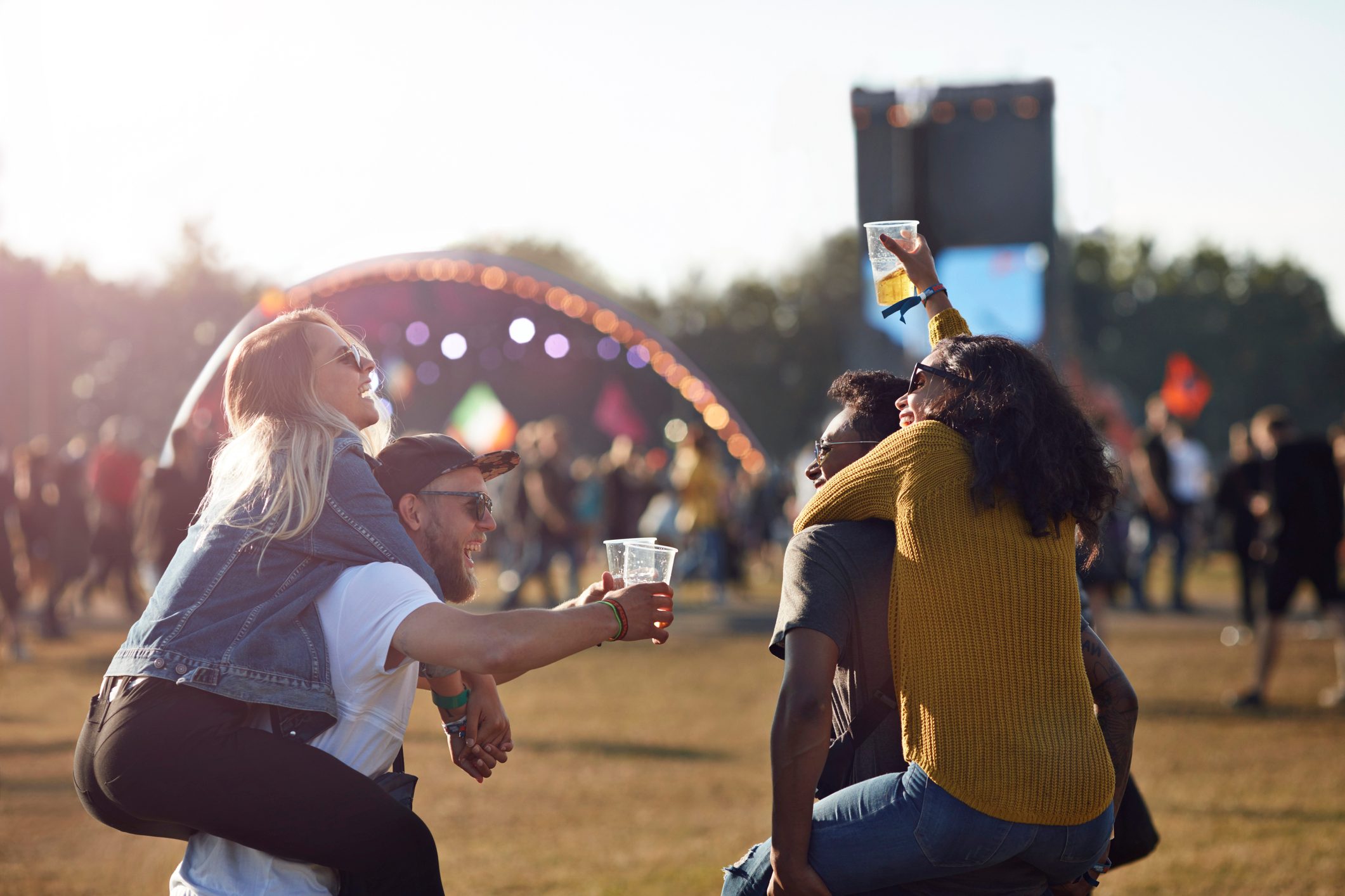 friends at music festival convert