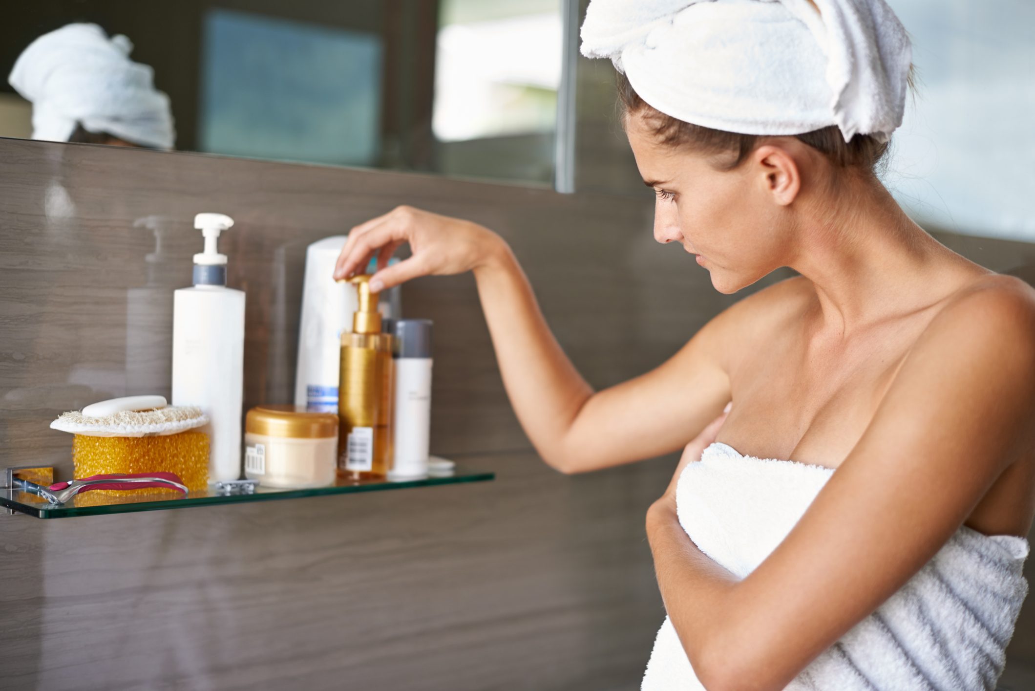 woman in towel after shower in bathroom